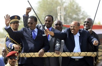 Chad's President Idriss Deby and Sudan's President Omar Hassan al-Bashir wave to the crowd after launching the Darfur Regional Authority in El Fasher, February 8, 2012. The new regional body will promote development and be responsible for the governance. by Pan-African News Wire File Photos