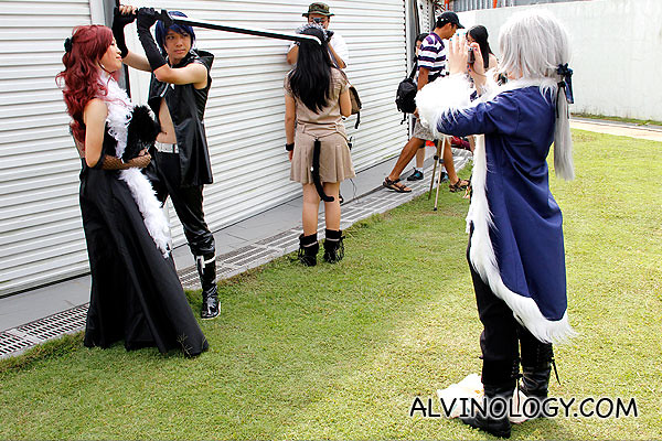 Another picture of cosplayer taking a photo of cosplayer