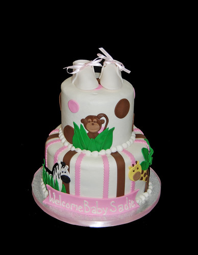 pink and brown jungle animal baby shower cake - monkey, giraffe, zebra