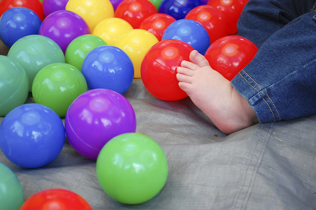 Baby feet and ball pit balls.