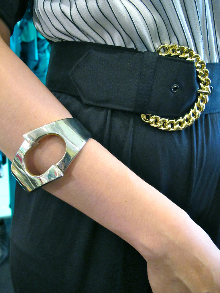 Mix silver with gold: A 1960s silver-tone mod bangle, and a 1980s belt with gold-tone buckle.