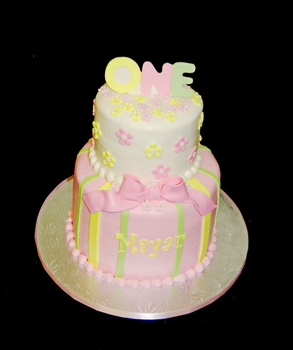 pink yellow and green 1st birthday cake