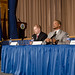 United States Department of Labor Office of Disability Employment Policy, Policy Advisor Patrick Cokley (at podium) introduced and moderated the discussion panel of Federal Aviation Administration National Outreach Team for Diversity and Inclusion National People with Disabilities Program Manager Michael Looney (third from right), United States Department of Agriculture (USDA) Departmental Management Office of Human Resources Management Deputy Director William P. Milton, Jr. (second from right), and USDA Food Safety and Inspection Service Meditation and Life/Work Services Division Program Support Assistant Madison Carter (right)