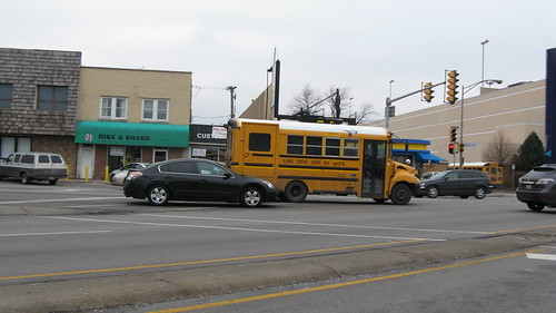 Small International school bus on West Irving Park Road.  Chicago Illinois USA.  February 2012. by Eddie from Chicago