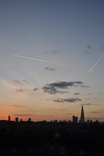 Plane trails over south London sunset