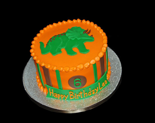 orange brown and green triceratops 6th birthday cake