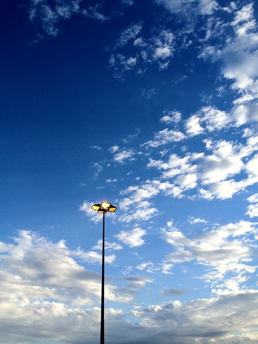 Light post, blue skies and clouds by _camilo