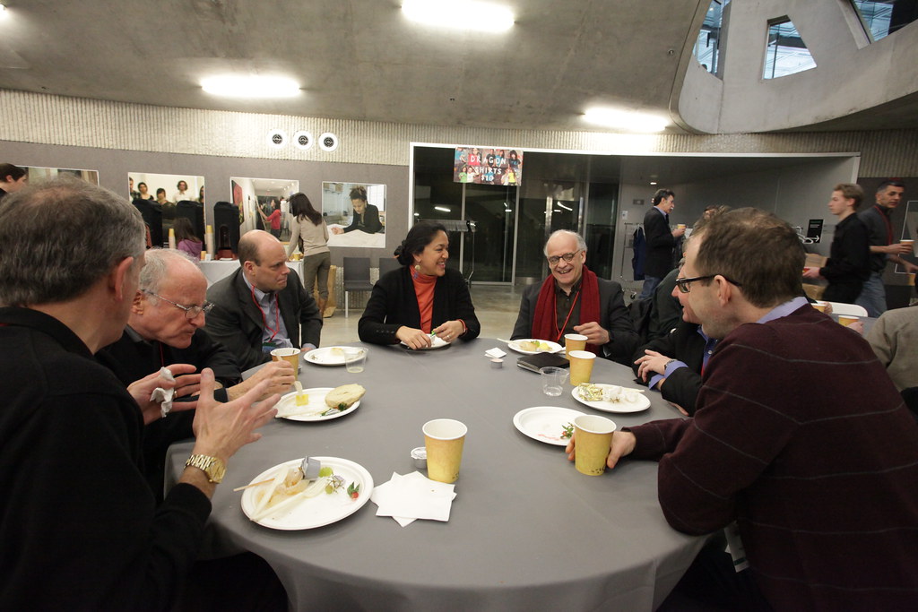 College alumni and faculty enjoy a Saturday morning breakfast with faculty.