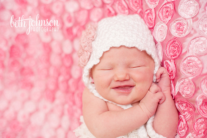 tallahassee baby girl on pink blanket with big smile newborn photographer