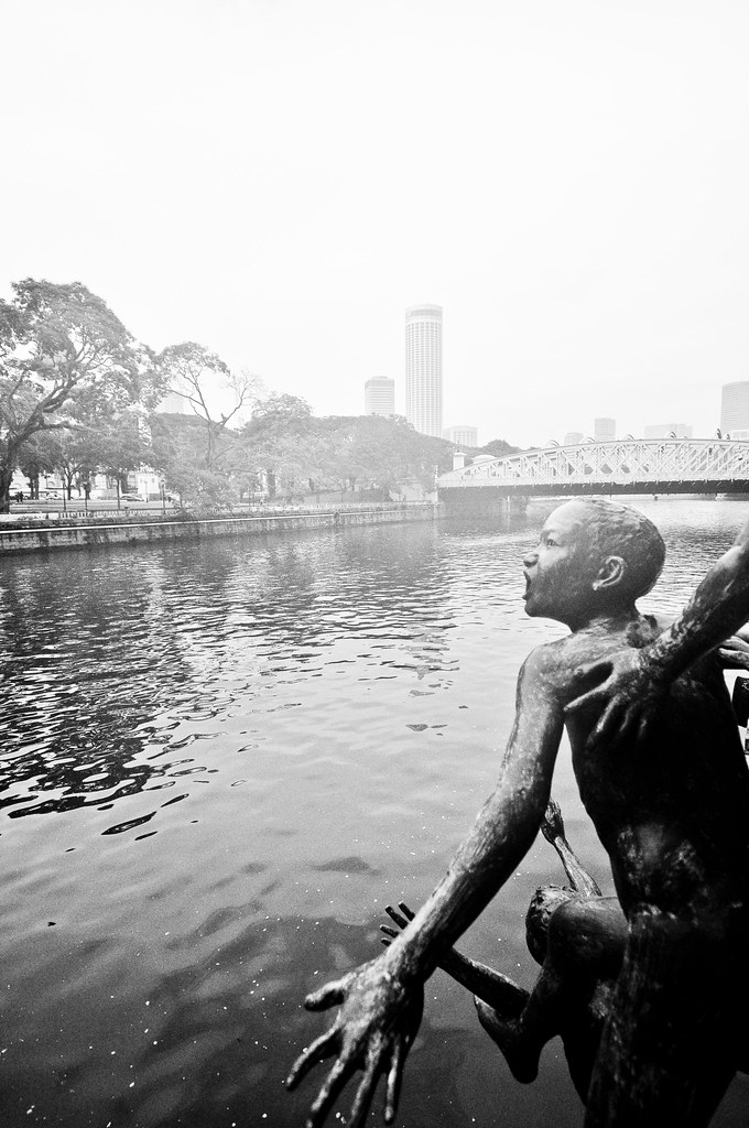 Boat quay pier boys jumping into river statue ...