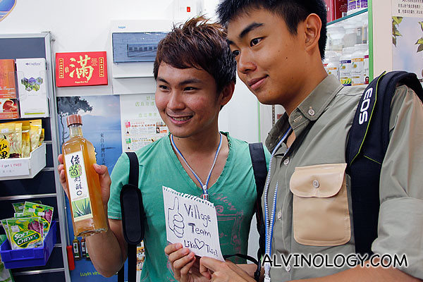 William and Nigel posing with a bottle of Luyin vinegar