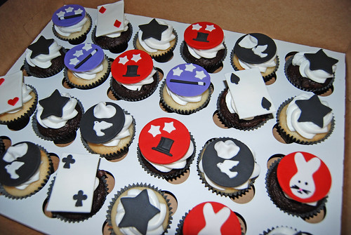 magic themed cupcakes for a 7th birthday - stars, top hat, magician wand, cards, dove