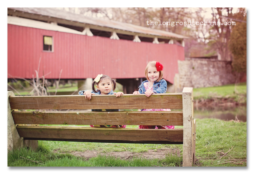 Backwards on the bench in front of the covered bridge BLOG