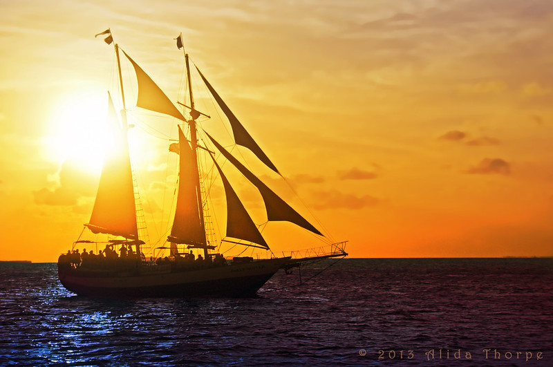 ship sailing at sunset