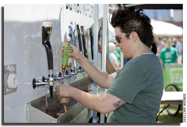 Stacy Carroll pours a Harp beer from the beer tent. Proceeds went to Realm, the Tampa Downtown Partnership’s task force that helps revitalize downtown parks.