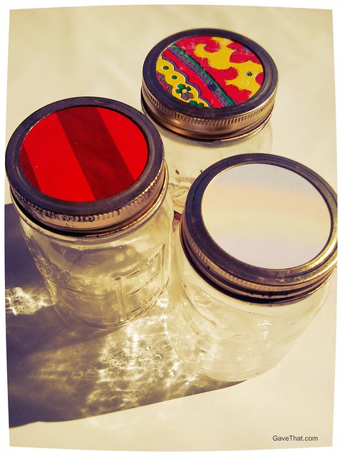 Adding bits of gift wrap on top of canning jar lids how to recycle wrapping paper ideas