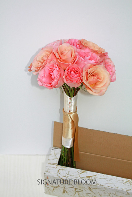 Our pink peach and gold wedding bouquet of roses was made with simplicity in