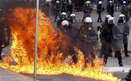 Greek riot police battle demonstrators in downtown Athens during rebellions against the imposition of a new round of austerity measures in the European state. The world capitalist crisis has swept through Europe causing great destruction. by Pan-African News Wire File Photos