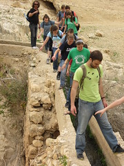 A group of students, headed by Andrew Hostetter, cross an ancient aqueduct built by Herod the Great