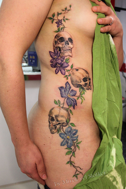skulls with clematis tattoo by Mirek vel Stotker