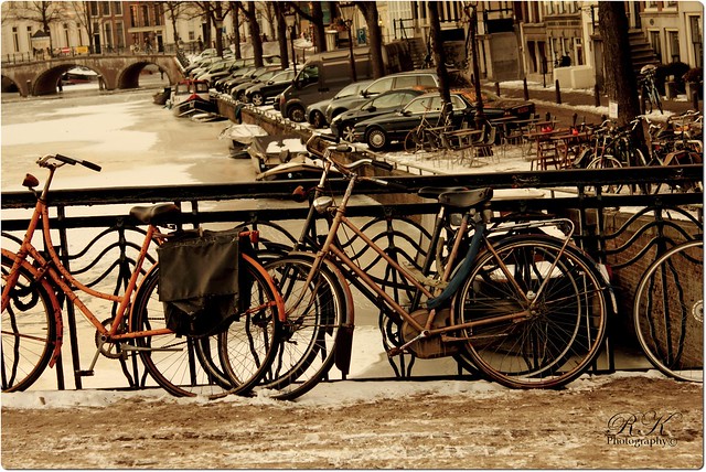 Bicycles parked near canal