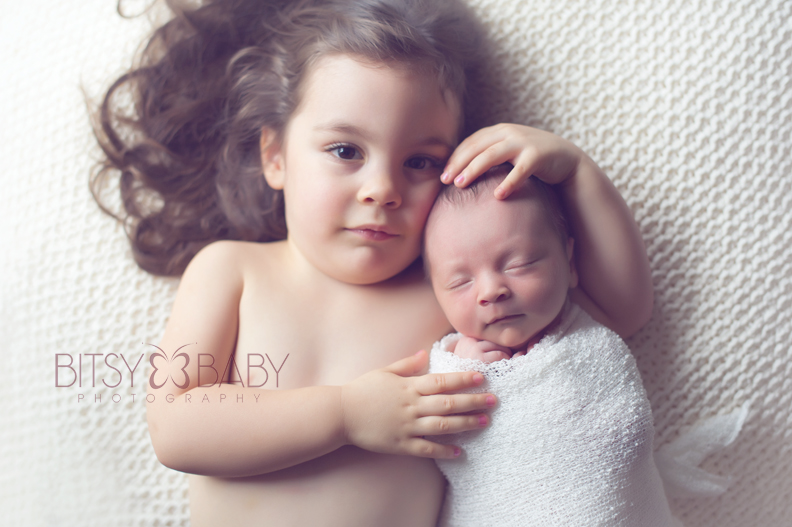 newborn with sibling