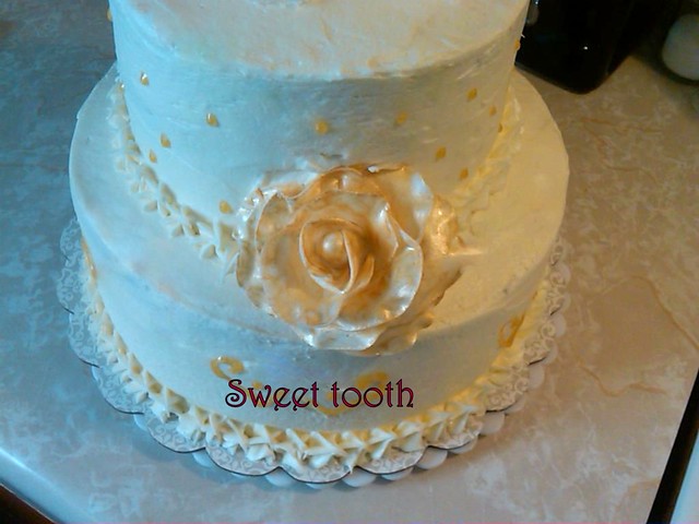 Gold and Ivory Red Velvet Wedding Cake With handmade gold dusted roses