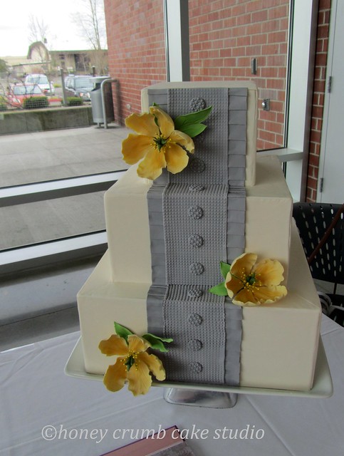Grey BoxPleated Wedding Cake with Yellow Sugar Blooms