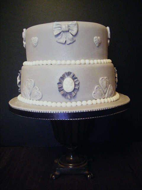 2 tier wedding cake covered with lilac fondant icing and decorated with 