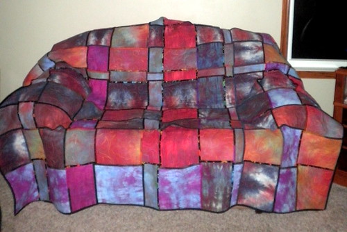 The woven quilt as a slip cover on my couch