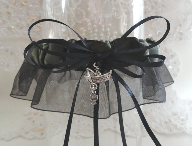 The garter is made from OD olive drab camo grosgrain with a black organza 