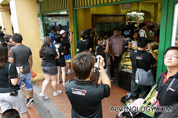 A group of Panasonic photographers invading a store in Little India
