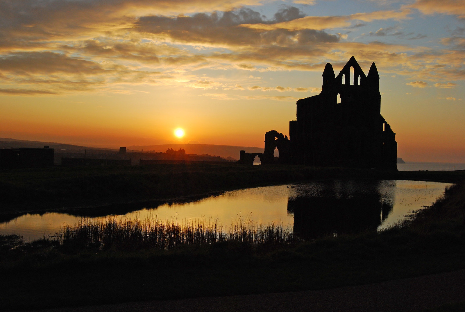 Whitby Abbey at sunset with reflections. Credit Ackers72