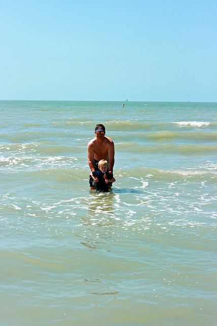 dad and brooks in the ocean