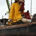 Sea Odyssey: Giant Girl Putting on Raincoat