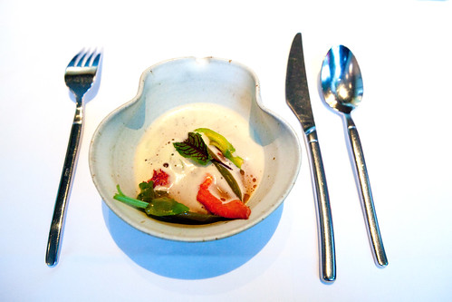 Tasting menu course #4: Mediterranean-style fish soup, saffron broth, lobster, squash blossom, sorrel