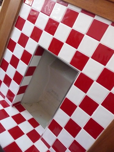 Red and white tiled fireplace