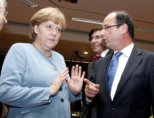 François Hollande, the new French President, talks to German Chancellor Angela Merkel, Brussels, 23 May 2012