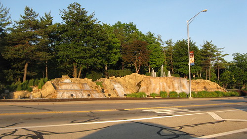 The picturesque man made waterfall at Higgns Avenue and River Road.  Rosemont Illinois. May 2012. by Eddie from Chicago