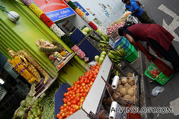 A lady buying vegetable