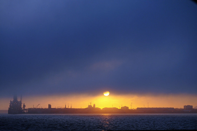 foggy sunset over the port