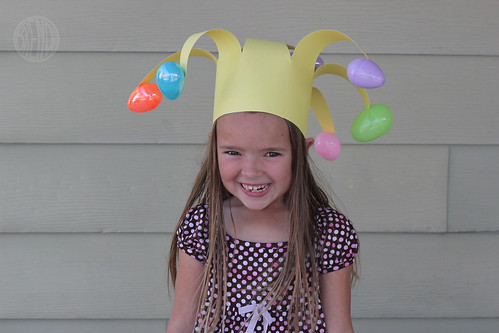 A child wearing floppy Easter egg jester hat 