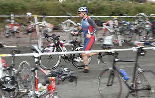 Image of a triathlon in transition between the cycle and the run