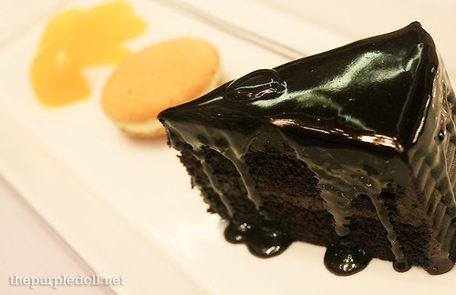 A Trio of Moist Chocolate Cake with Biscuit and Chilled Orange Compote