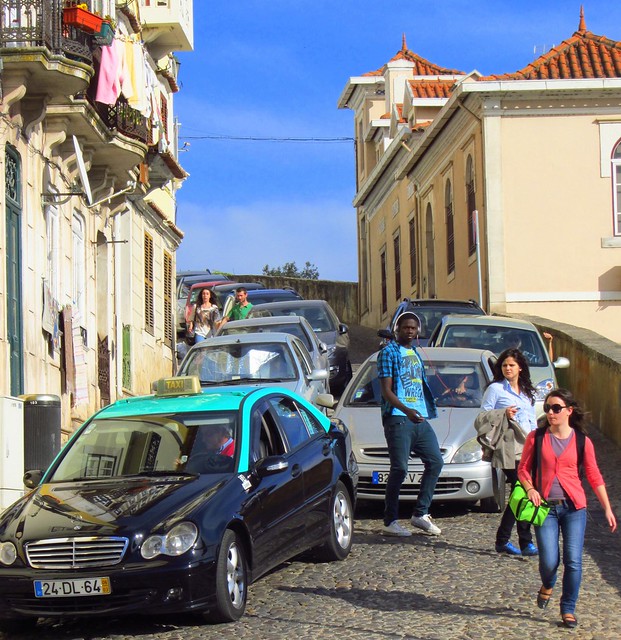 Coimbra University students negotiating the traffic, Coimbra, Portugal