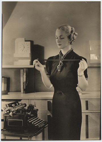 [Woman holding typewriter ribbon at Royal Typewriter] by SMU Central University Libraries