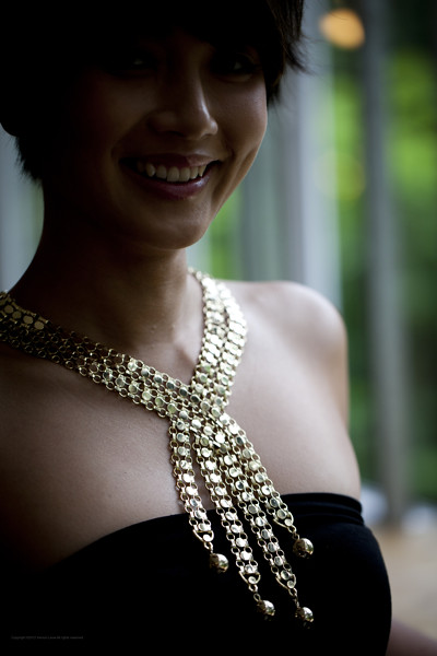  Fabulous gold-toned necklace that criss-crosses over your decolletage - reminds us of a waterfall somewhat. Stunning!