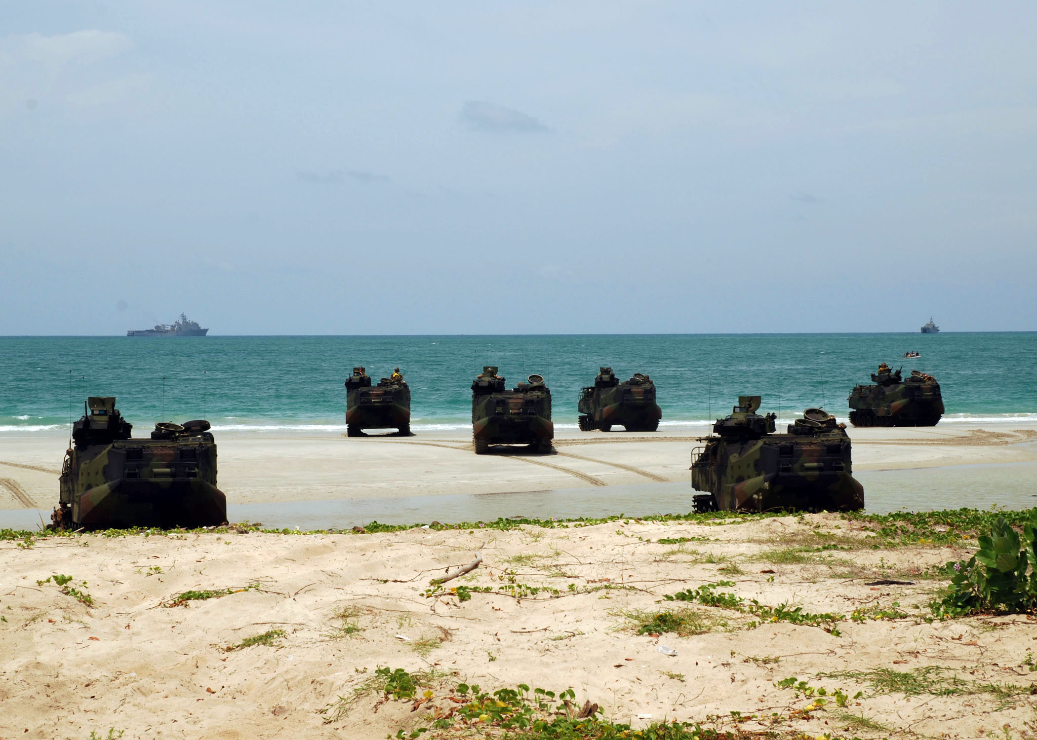 Royal Thai and U.S. Marine amphibious assault vehicles land on the beach during a simulated amphibious assault for Cooperation Afloat Readiness and Training Thailand 2012.