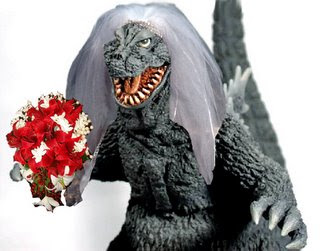 A Godzilla statue wearing a bridal veil