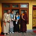 Four Tibetans reverently waiting for His Holiness Dagchen Sakya, upstairs near the dining hall & kitchen, Tibetan door covers swing in the breeze, Sakya Lamdre, Tharlam Monastery of Tibetan Buddhism, Boudha, Kathmandu, Nepal